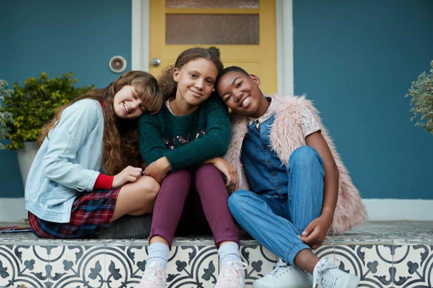 3-happy-girls-relaxing-on-porch