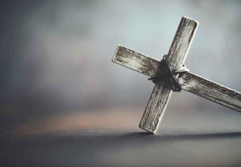 Cross in rustic setting. Religious background with copy space