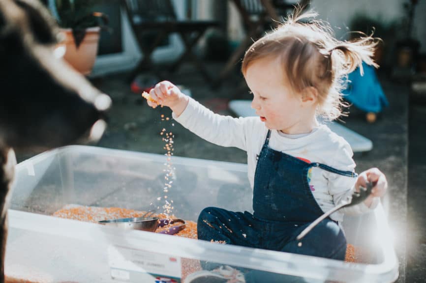 Cute little girl playing with sensory equipment