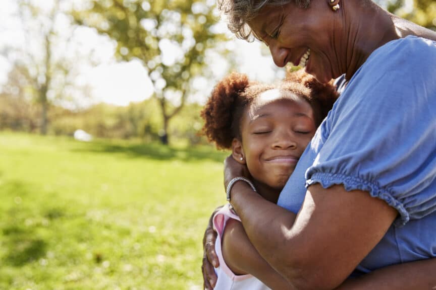 granddaughter hugging grandmother