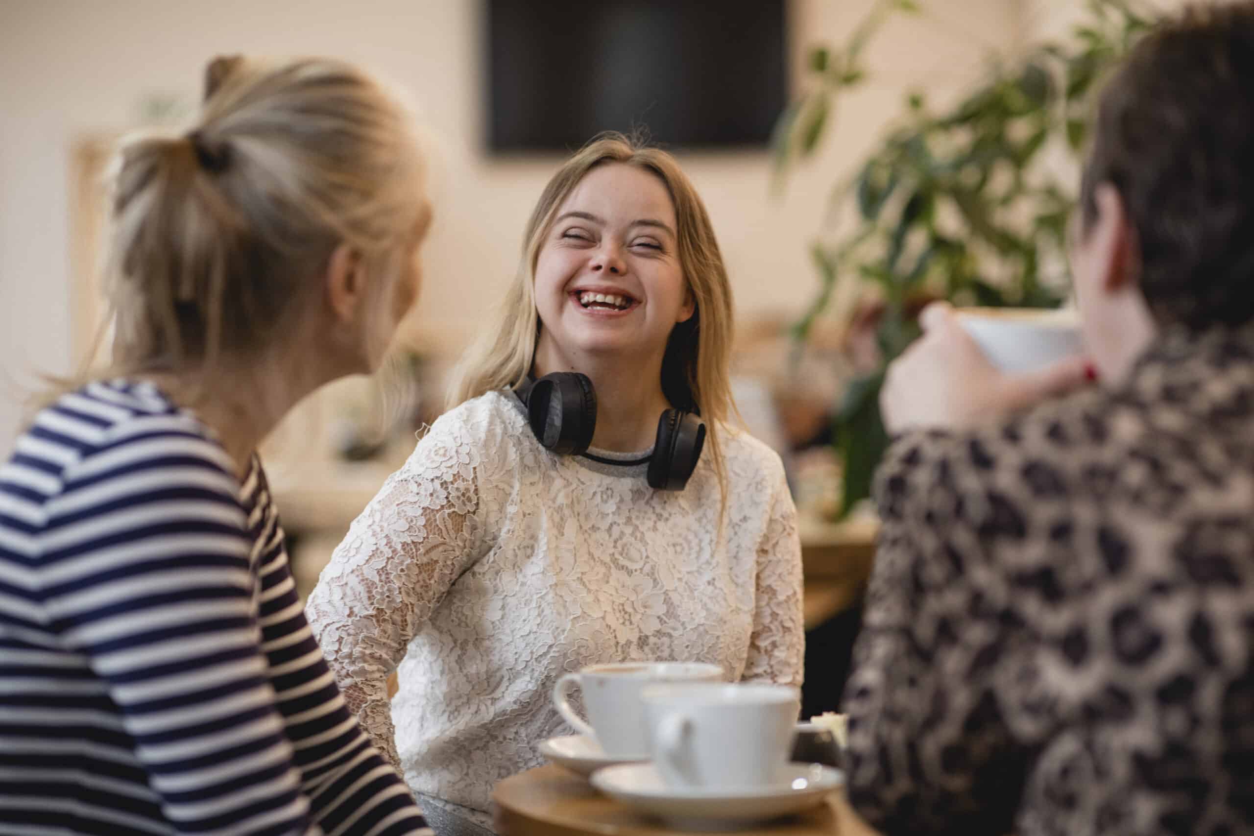 happy special needs girl drinking coffee