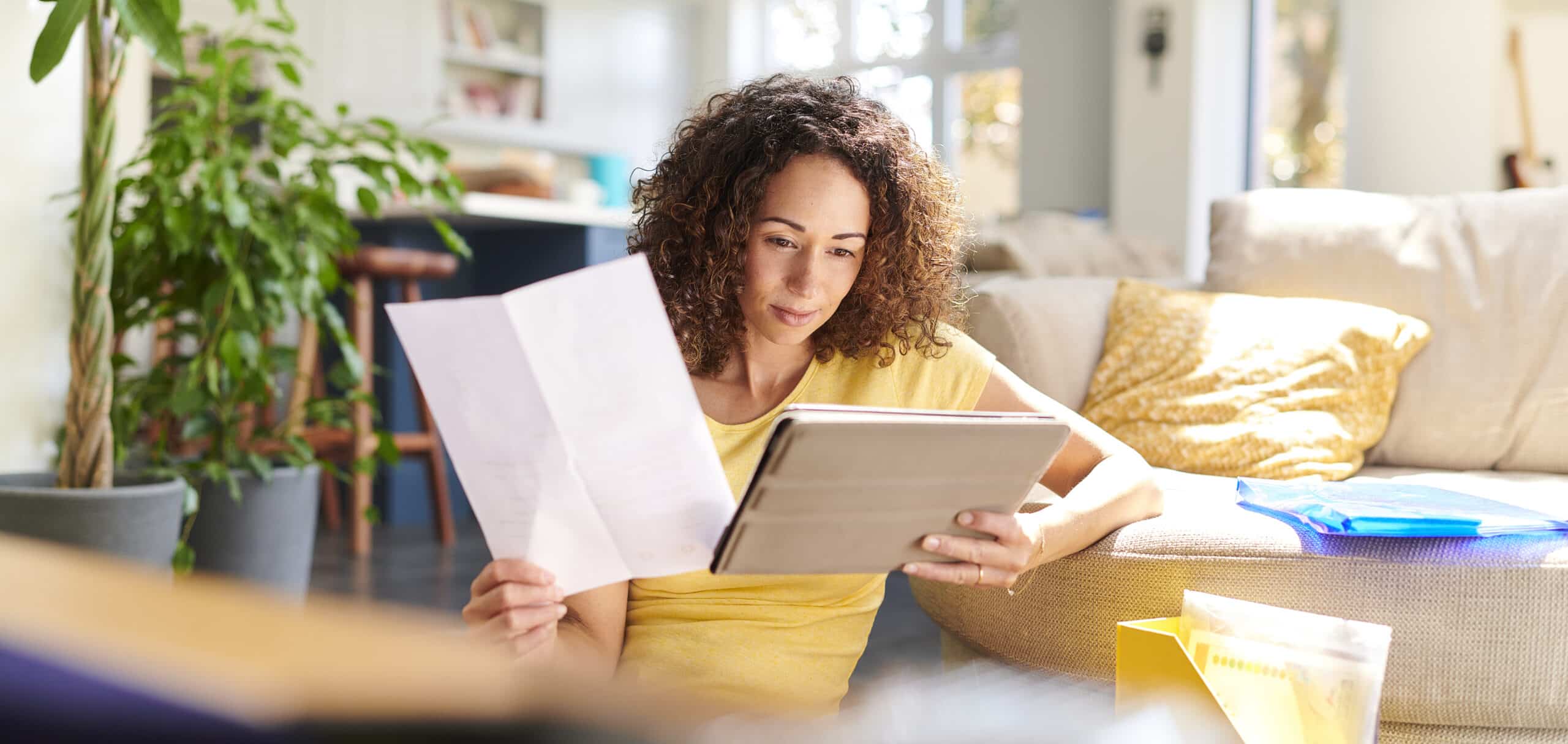 woman comparing papers