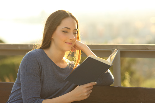 woman reading outside