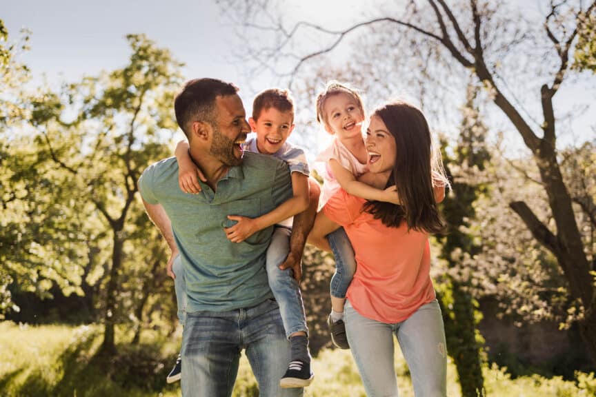 parents smiling with kids