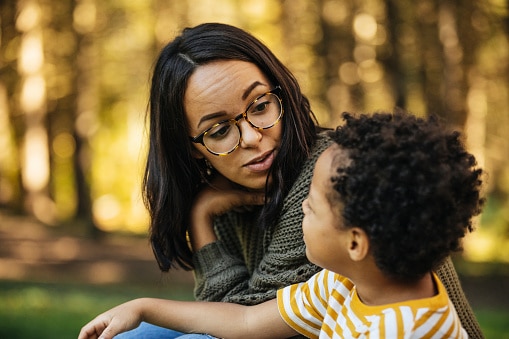 mother talking to young son