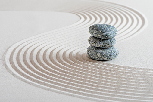 Stacked stones in a sand garden