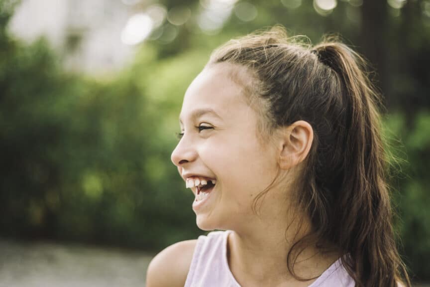 side view of girl laughing