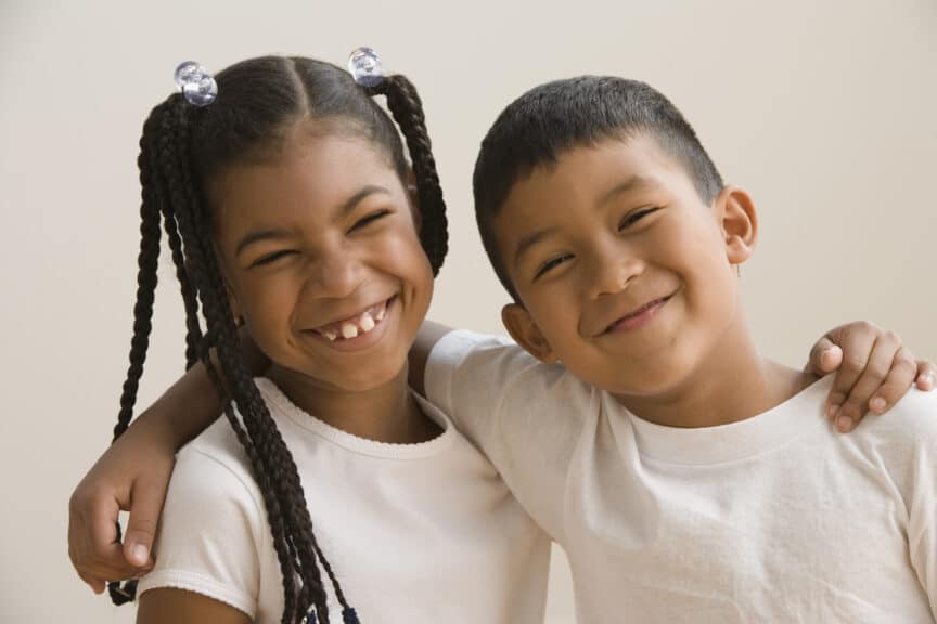 brother and sister hugging