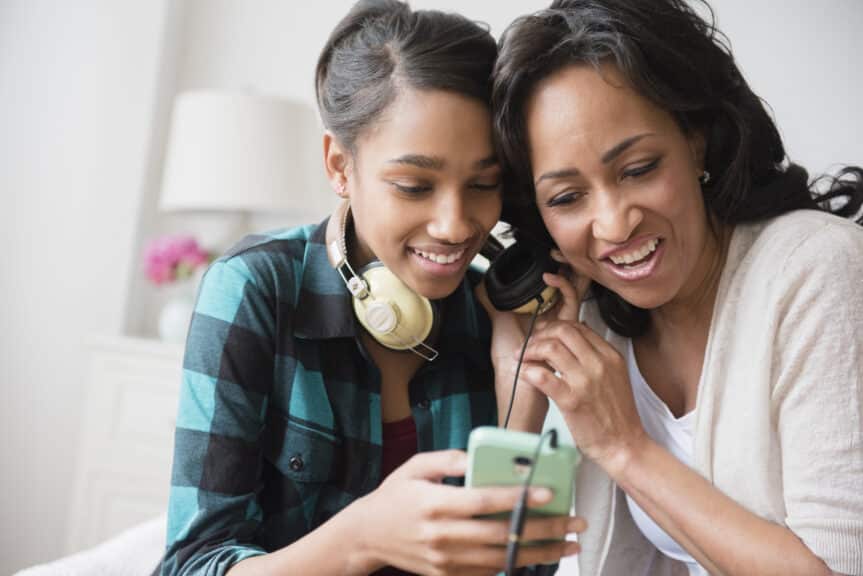 mom and daughter listening to music