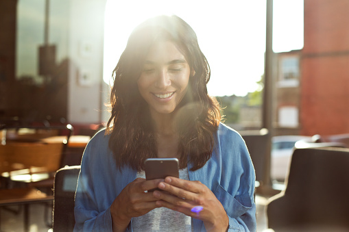 Young woman texting