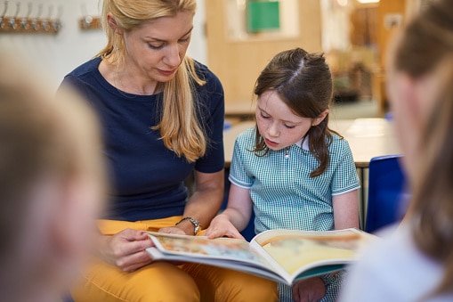 teacher reading with child