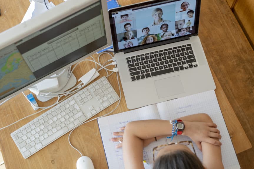 children are attending school remotely in