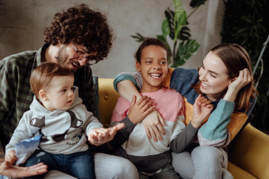 Happy family sitting on the couch