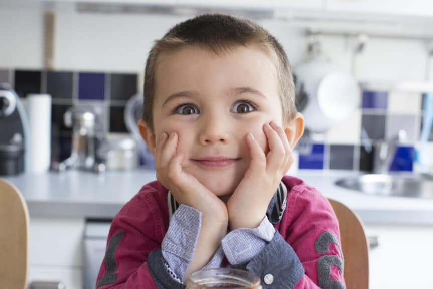 Little boy with chin resting on hands