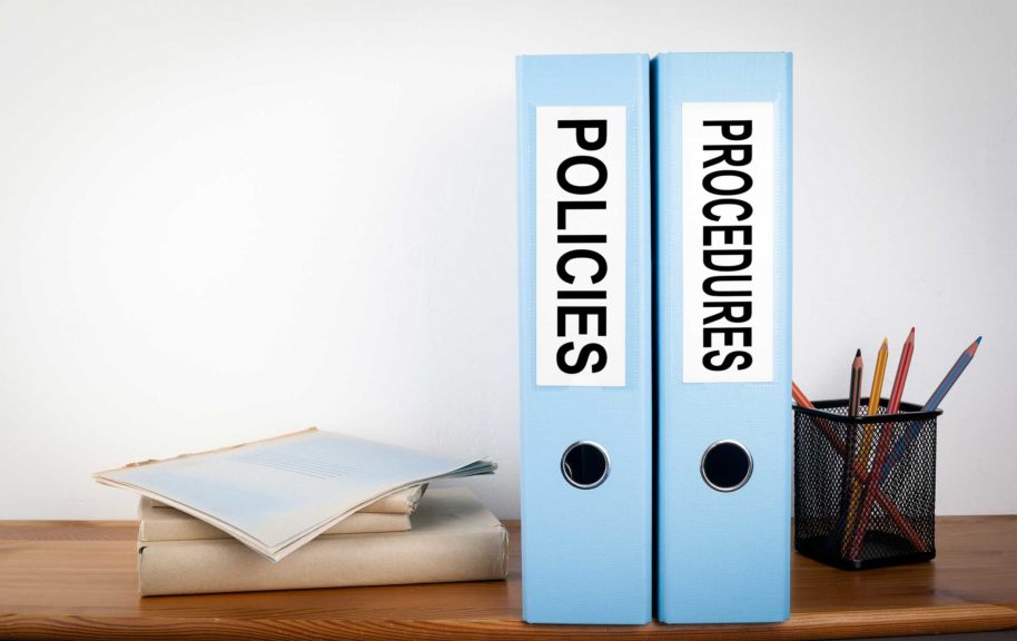 Policies and Procedures binders in the office