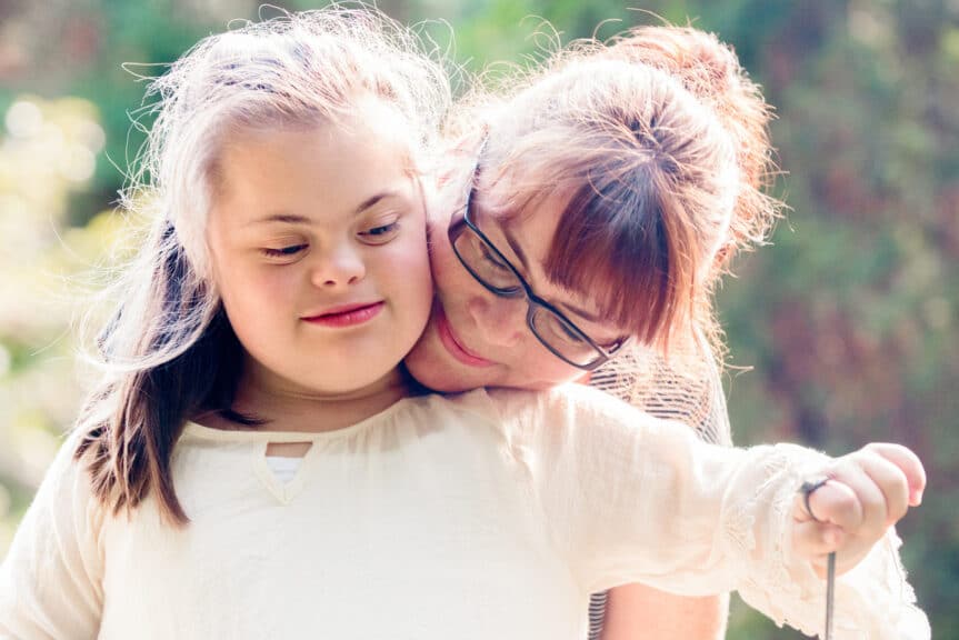 Portrait-of-mother-with-her-daughter-of-12-years-old-with-Down-Syndrome