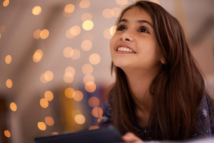 Shot of a cute little girl using a digital tablet