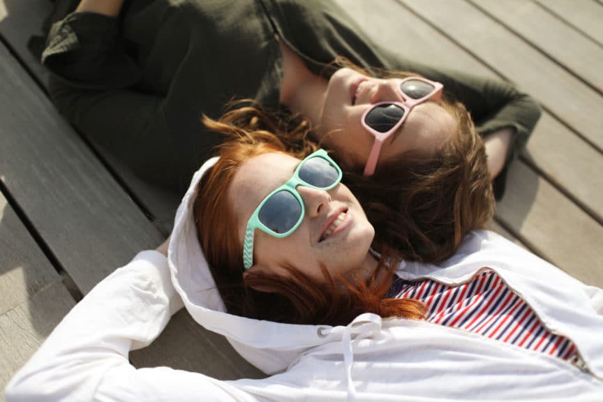 Two young women enjoying on the beach