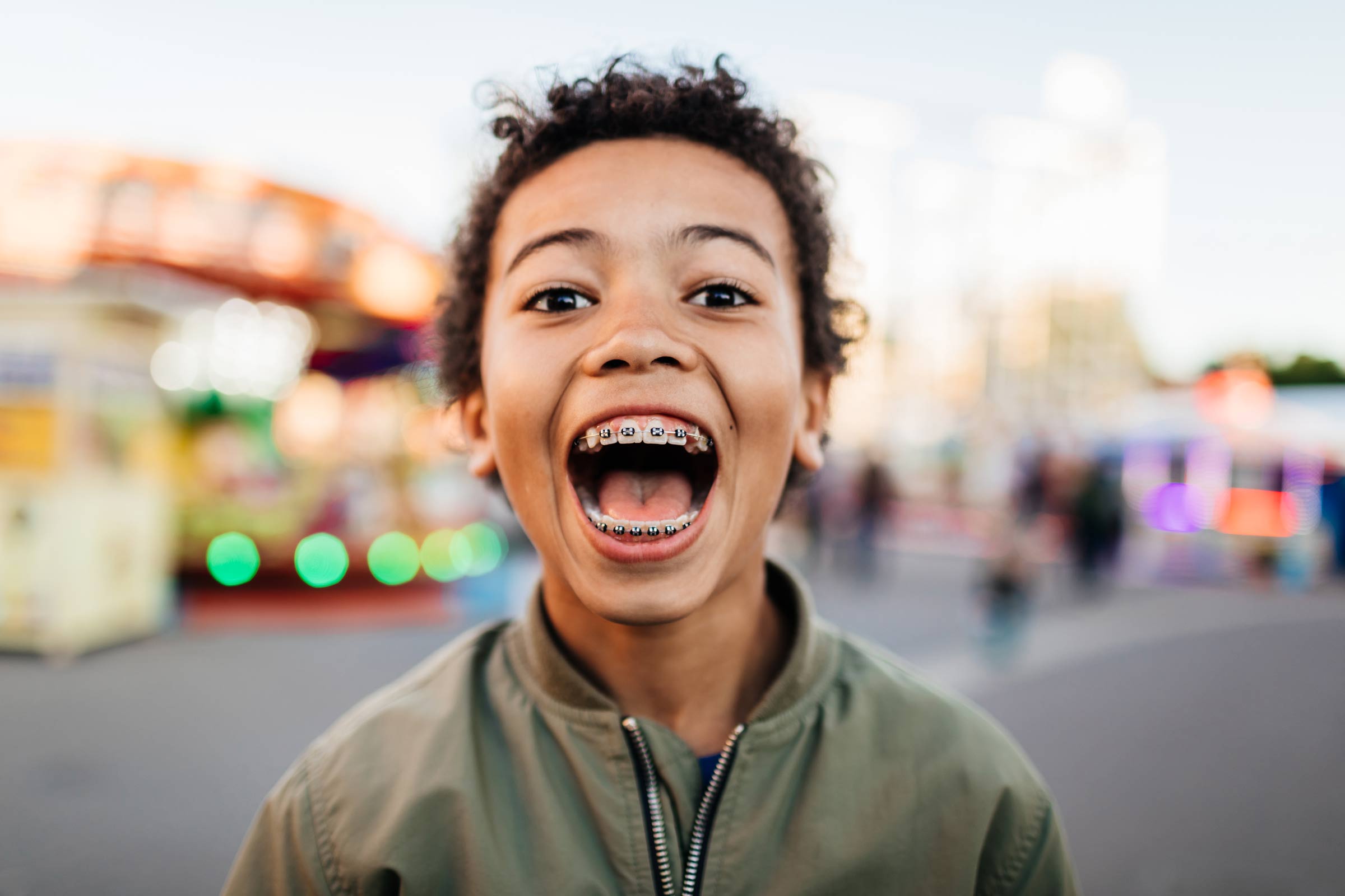 Young Boy With Mouth Wide Open At Fun Fair