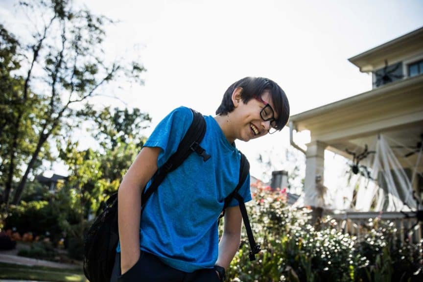 boy-laughing-outside-school