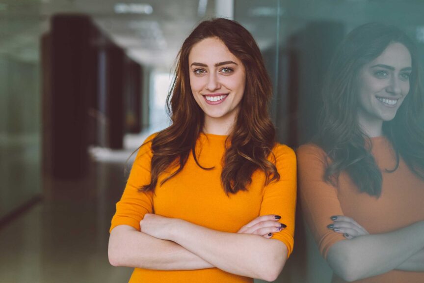 confident-young-woman-orange-shirt