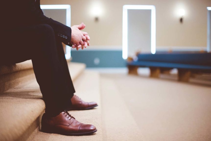 Elegant man on church stairs