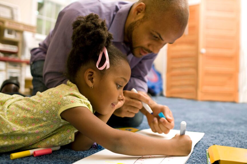 Father drawing with daughter