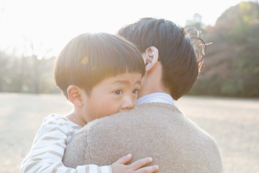 father-embracing-crying-son