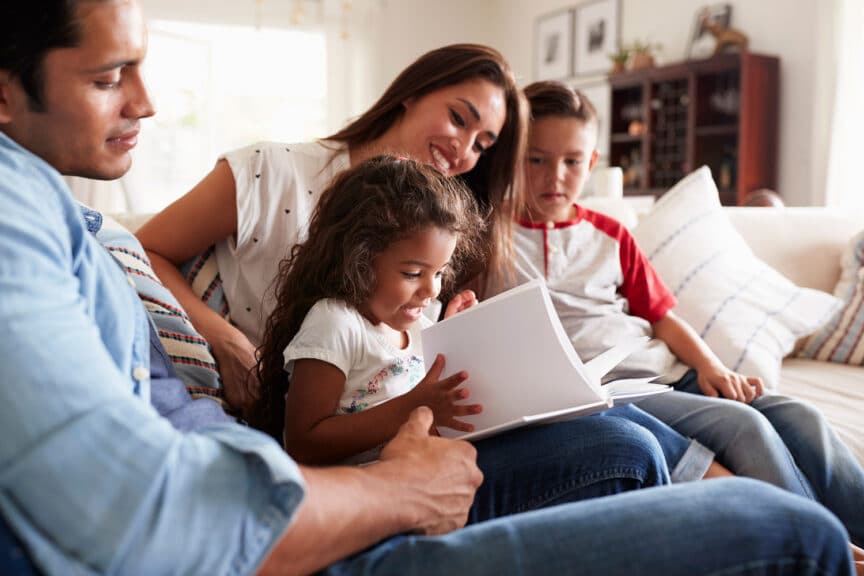 A family spends time together studying the Bible