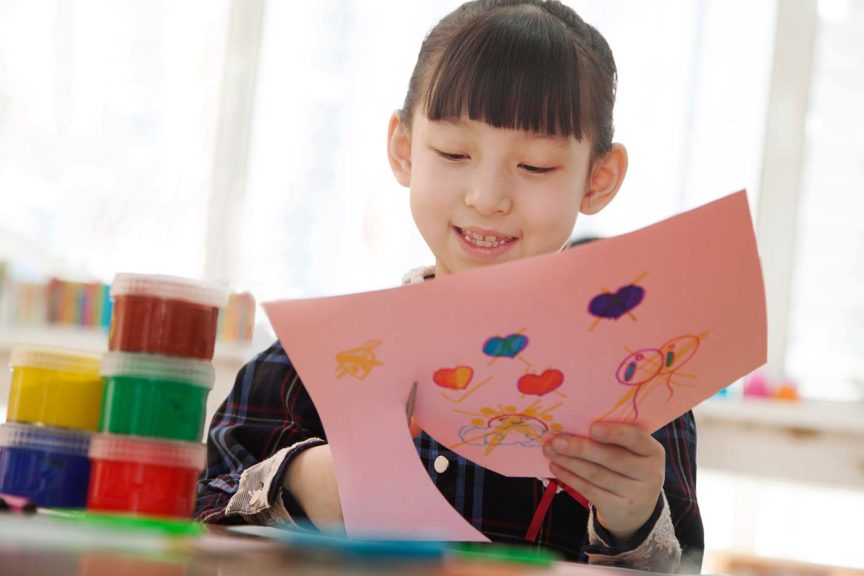 girl cutting craft paper