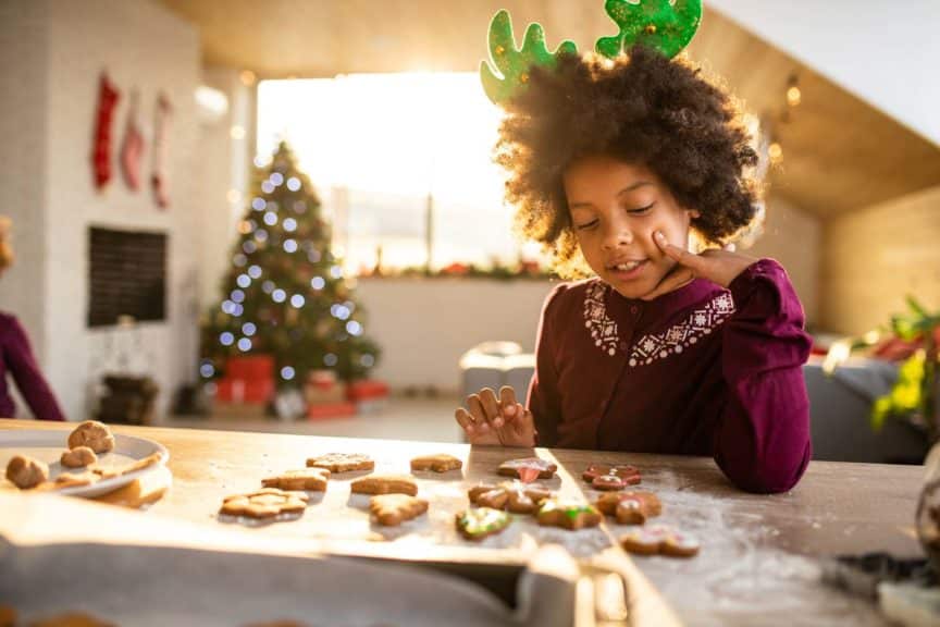 Girl decorating Gingerbread cookies