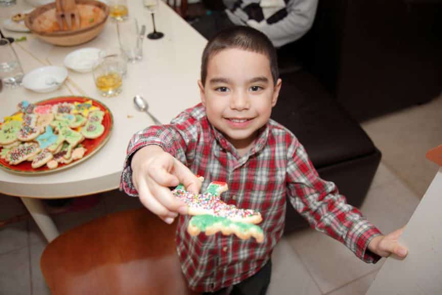 Happy Boy Offering Christmas Cookie