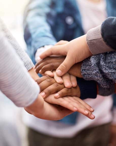 kids-hands-together-huddle