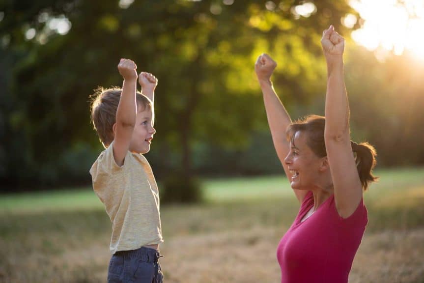 Little boy celebrating success with his mother