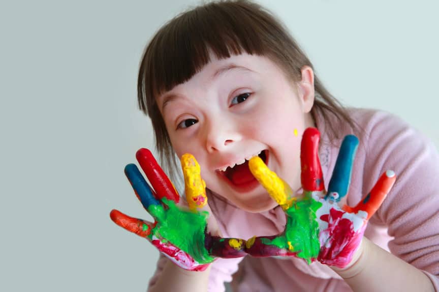 Cute little girl with painted hands