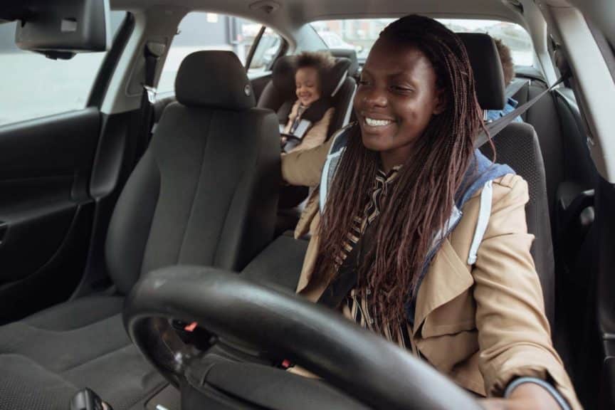 Mother driving kids to school