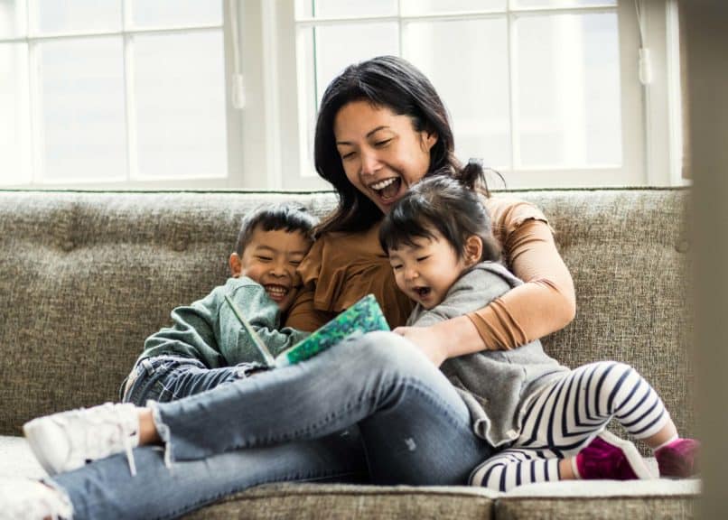 mother-on-couch-reading-kids