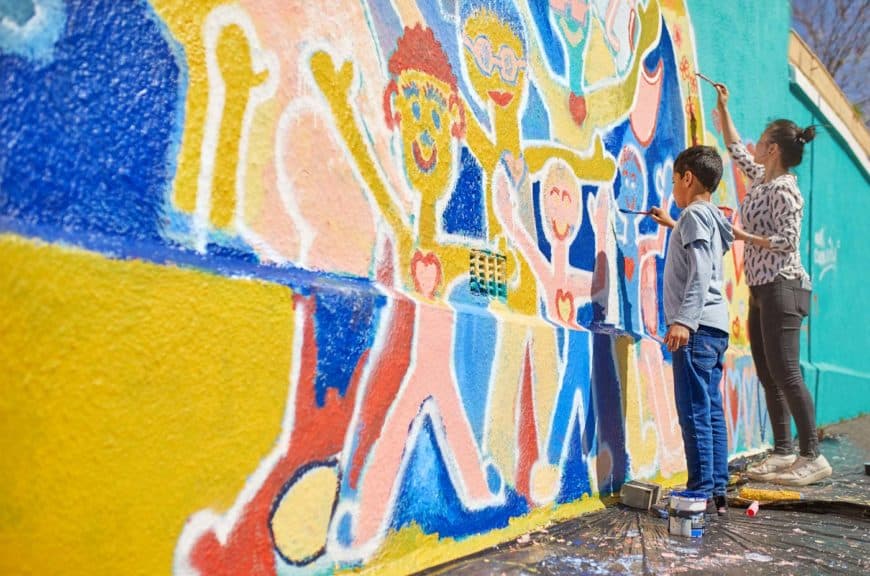 mother-son-volunteer-painting-mural-wall