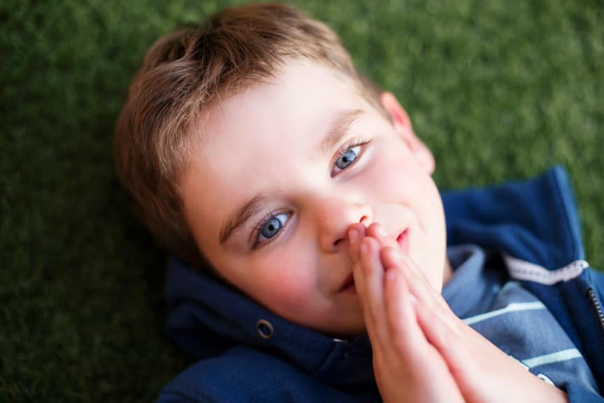 Overhead view of a boy praying
