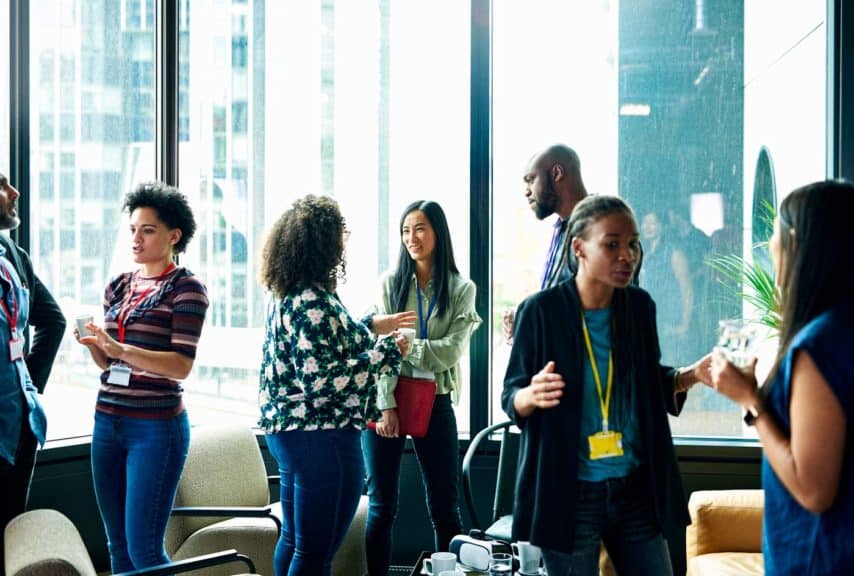 People having networking meeting in office