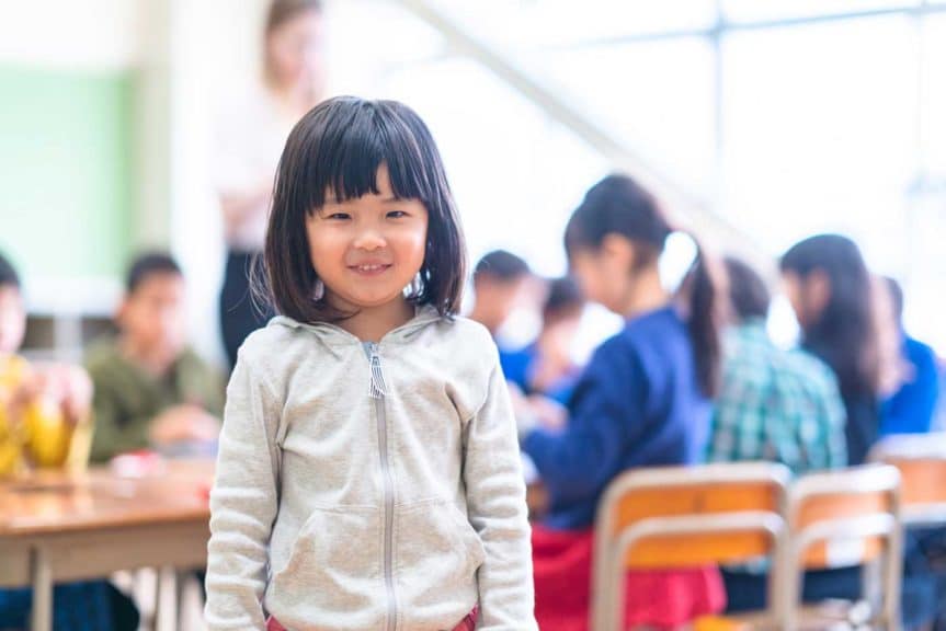 Portrait of cute little girl in classroom