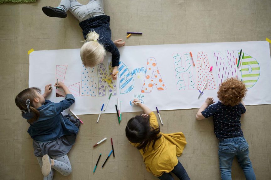 Preschool students with markers