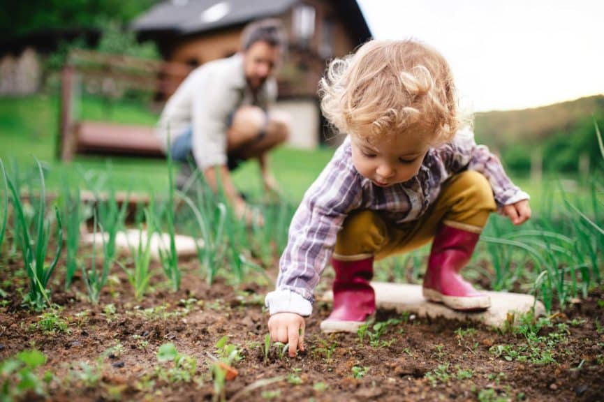 small-girl-father-outdoors-gardening