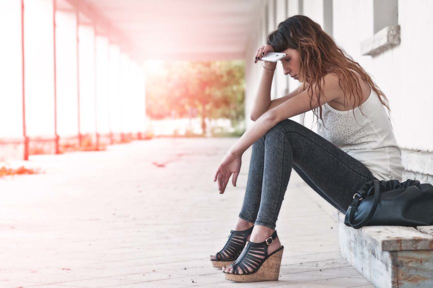 teenage girl depressed with phone