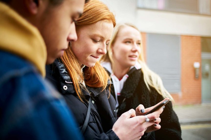 teenage girl checking phone