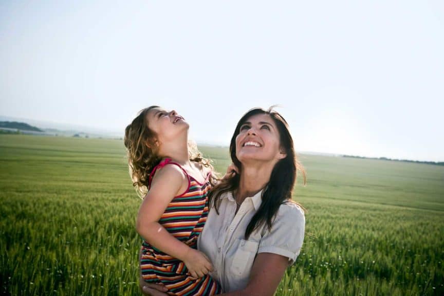 woman-and-child-looking-at-sky-open-space