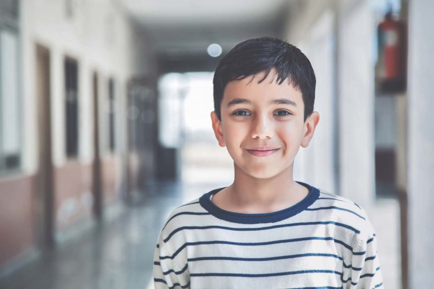 Portrait of a young school boy smiling